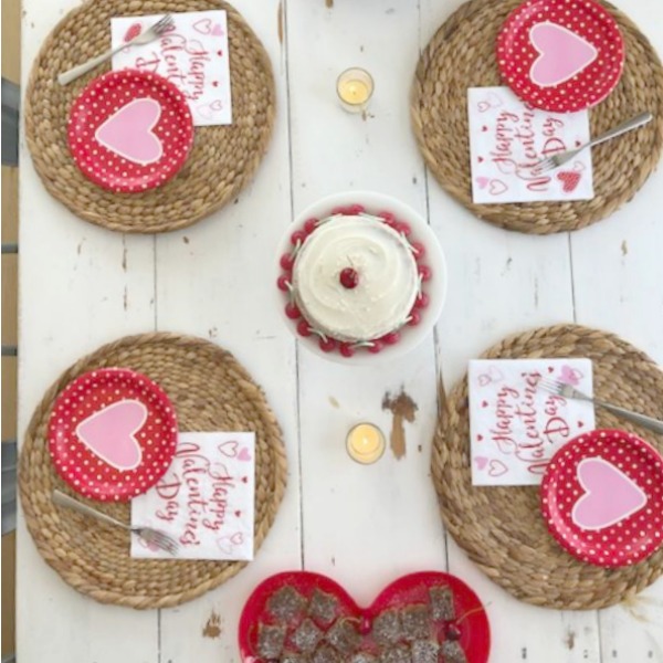 Vintage Valentine Decorations & Layer Cake. Come find simple inspiration for EASY, old fashioned, heart and love themed ideas like this simple layer cake with cherry lollipops and vintage cards on Hello Lovely Studio. #valentinesday #decorations #tablescape #layercake #vintagevalentinecards