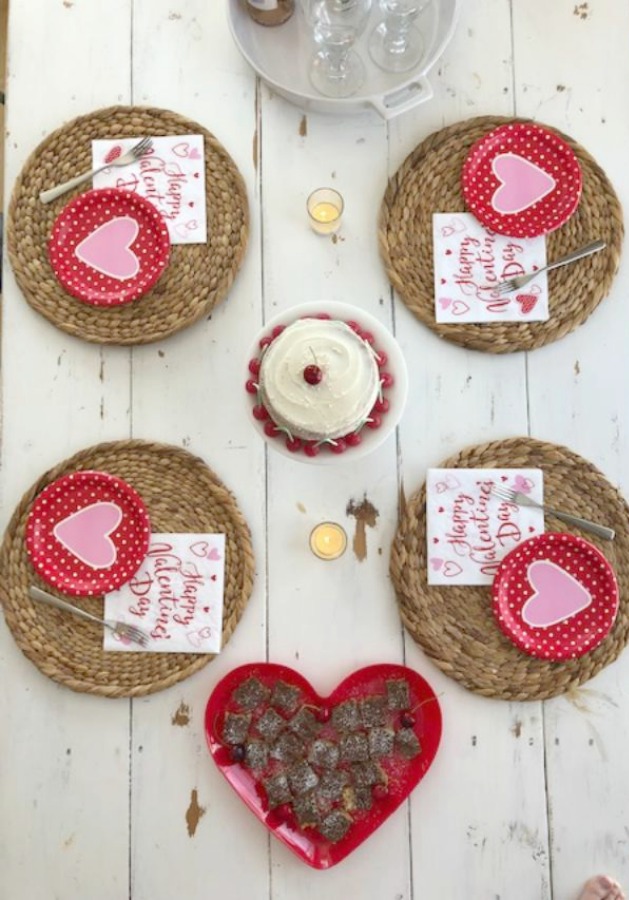 Vintage Valentine Decorations & Layer Cake. Come find simple inspiration for EASY, old fashioned, heart and love themed ideas like this simple layer cake with cherry lollipops and vintage cards on Hello Lovely Studio. #valentinesday #decorations #tablescape #layercake #vintagevalentinecards