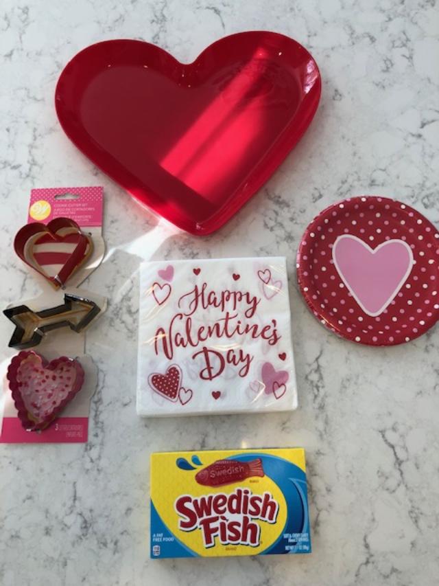 Vintage Valentine Decorations & Layer Cake. Come find simple inspiration for EASY, old fashioned, heart and love themed ideas like this simple layer cake with cherry lollipops and vintage cards on Hello Lovely Studio. #valentinesday #decorations #tablescape #layercake #vintagevalentinecards