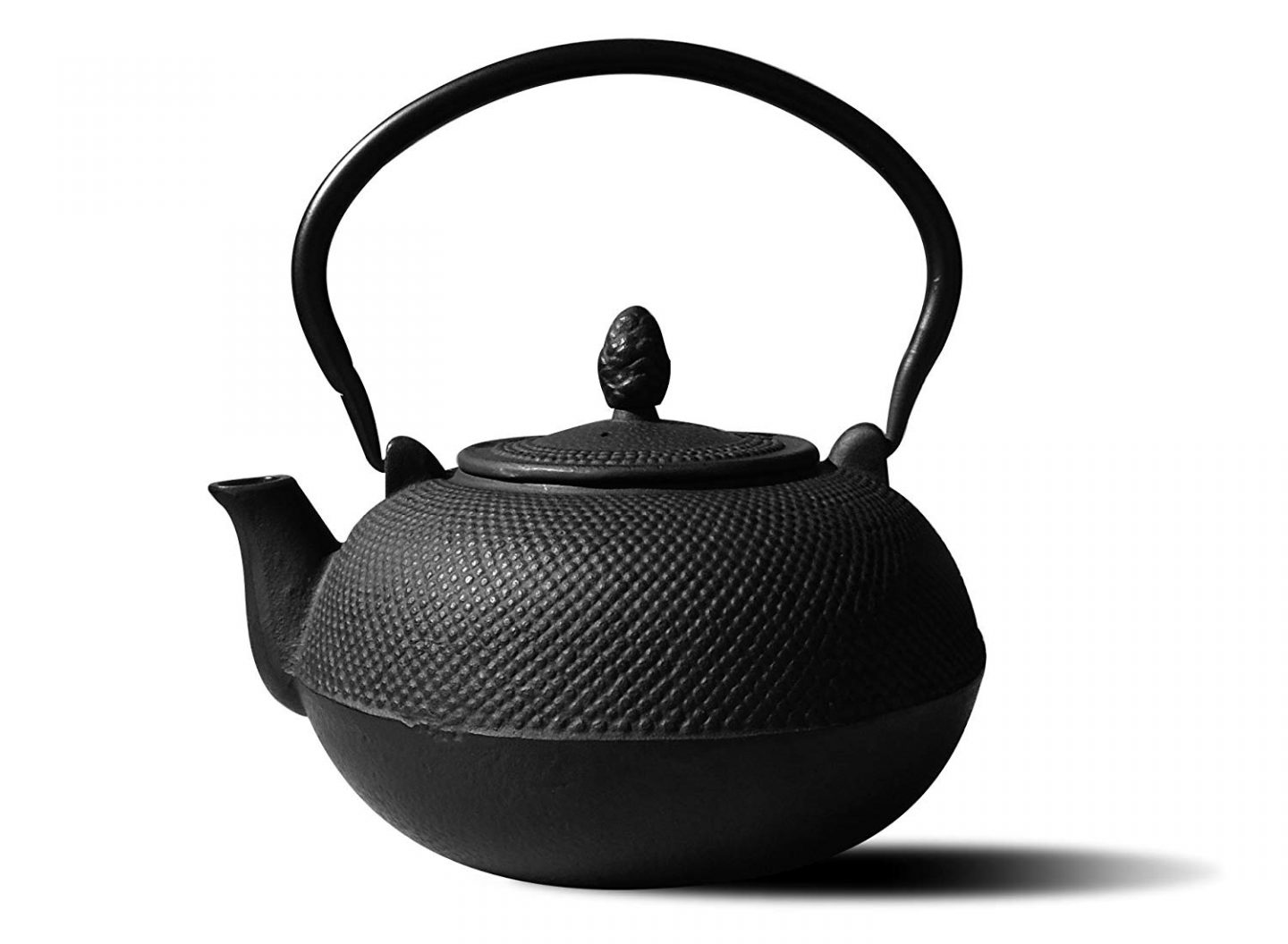 Black cast iron teapot.