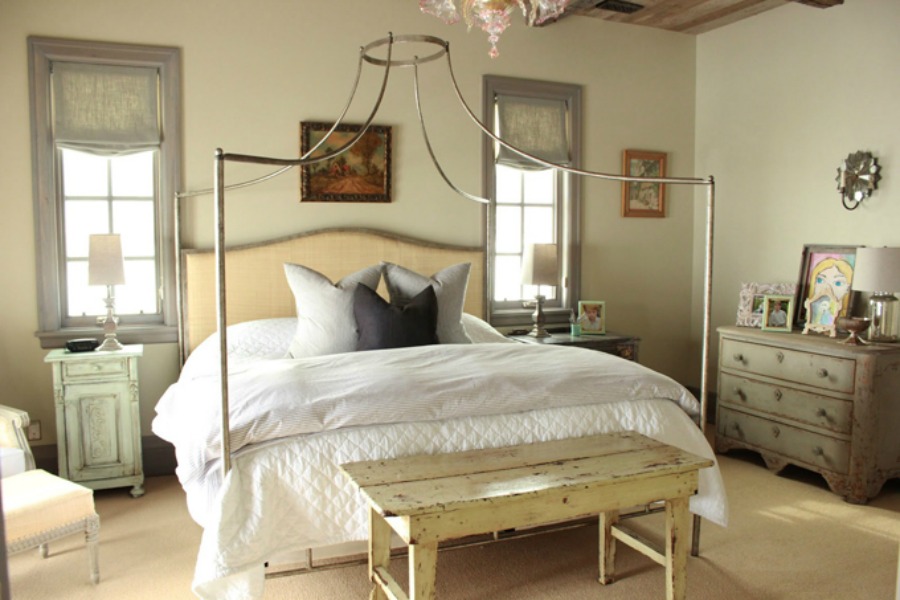 Lovely French country bedroom with blues and greens and magnificent bed by Oly Studio. Design by Decor de Provence.