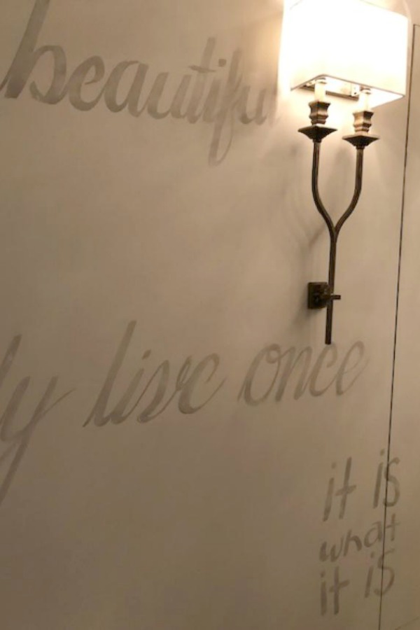 Charming script painted on a wall at RH Gallery in Chicago. Photo: Hello Lovely Studio.