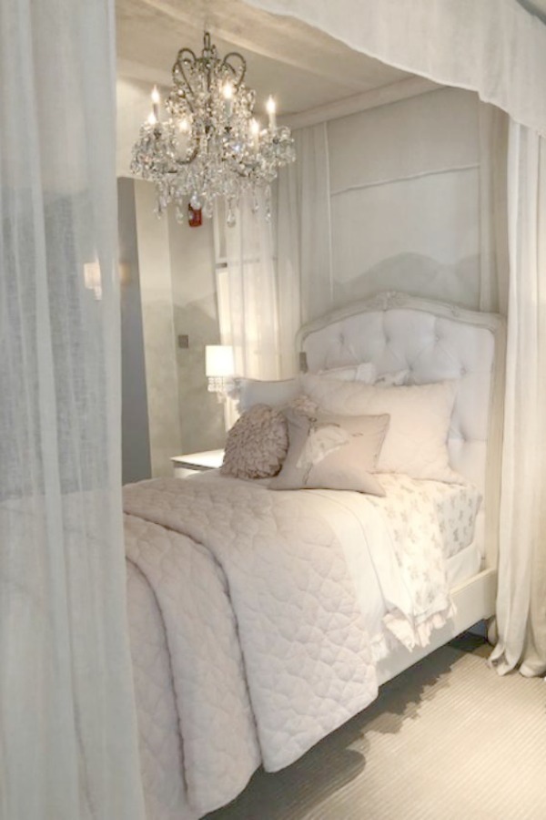 Muted tones in a magnificent French country girl's bedroom with canopy bed by RH at the gallery in Chicago. Photo: Hello Lovely Studio.