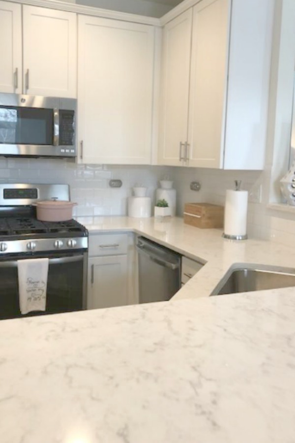 White kitchen with Viatera Minuet quartz countertops - Hello Lovely Studio.