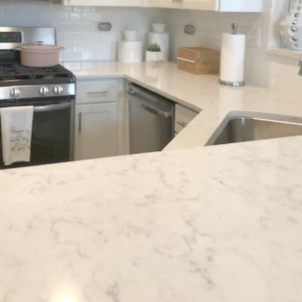 White kitchen with Viatera Minuet quartz countertops - Hello Lovely Studio.