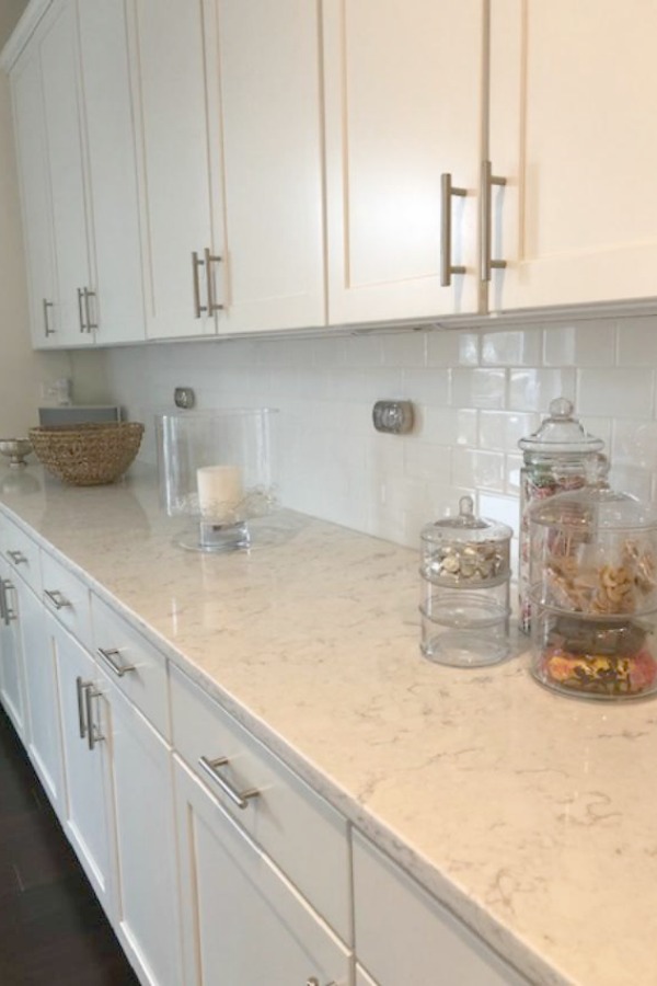 White kitchen with Viatera Minuet quartz countertops - Hello Lovely Studio.