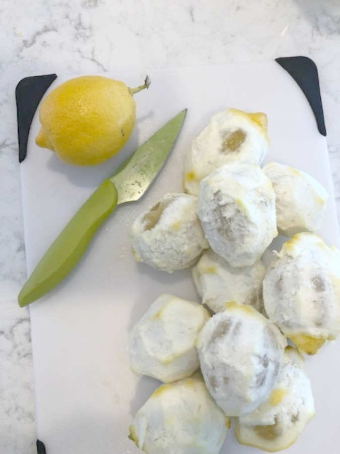 Photos of peeled lemons in preparation for limoncello recipe on Hello Lovely Studio.