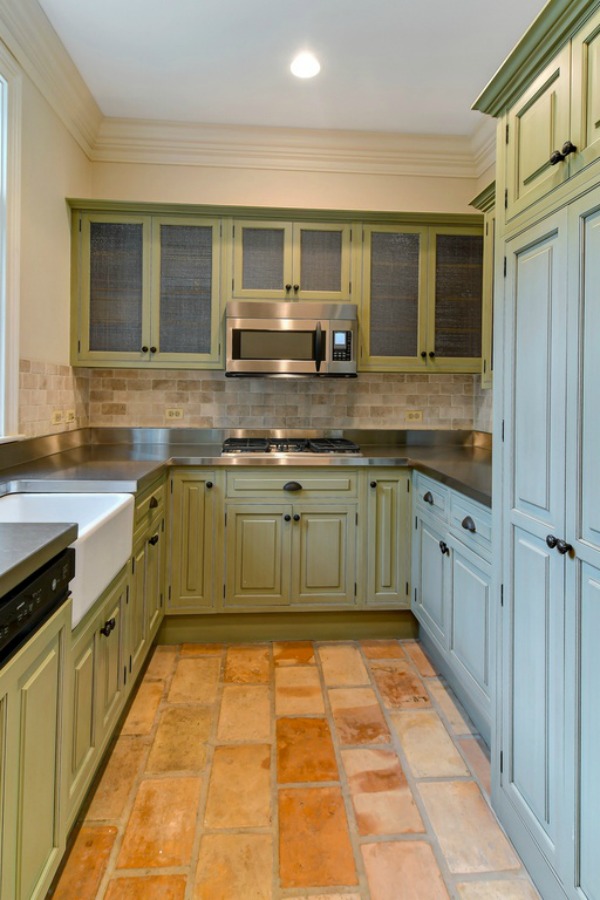 French farmhouse style in a scullery or pantry with beautiful terracotta stone floor in a grand Hinsdale home.