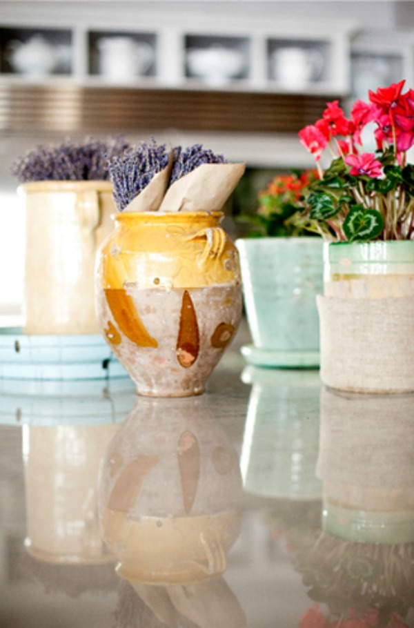 French country earthenware pots, lavender, and rustic elegant decor on a kitchen counter - Decor de Provence.