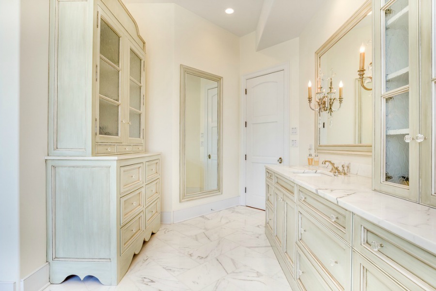 Luxurious white marble bathroom and pale glazed cabinets in a magnificent French Country home. Realistic Country French Decor from Luxurious Ideas...certainly lovely indeed. Decorating ideas for French country style rooms as well as shopping resources.