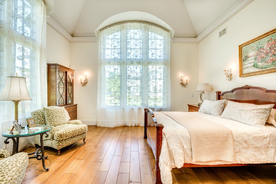 Romantic French country bedroom with arched windows. Realistic Country French Decor from Luxurious Ideas...certainly lovely indeed. Decorating ideas for French country style rooms as well as shopping resources.