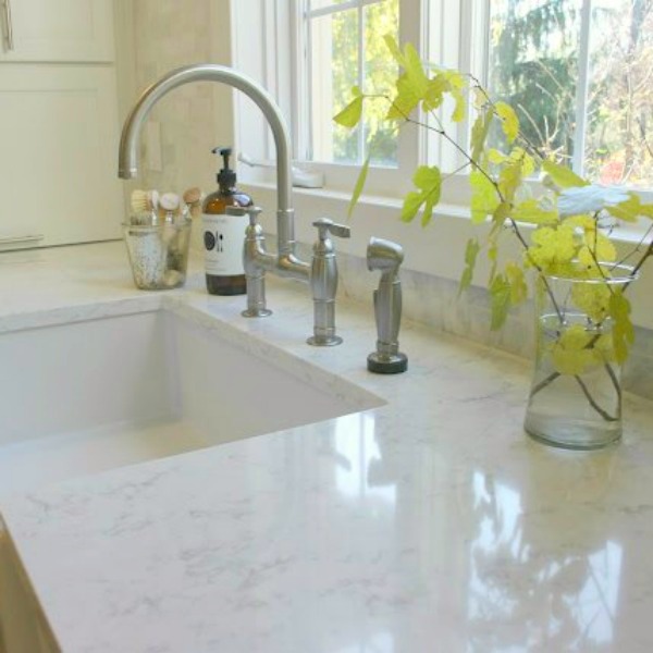 Viatera Minuet quartz countertop in white kitchen by Hello Lovely Studio.