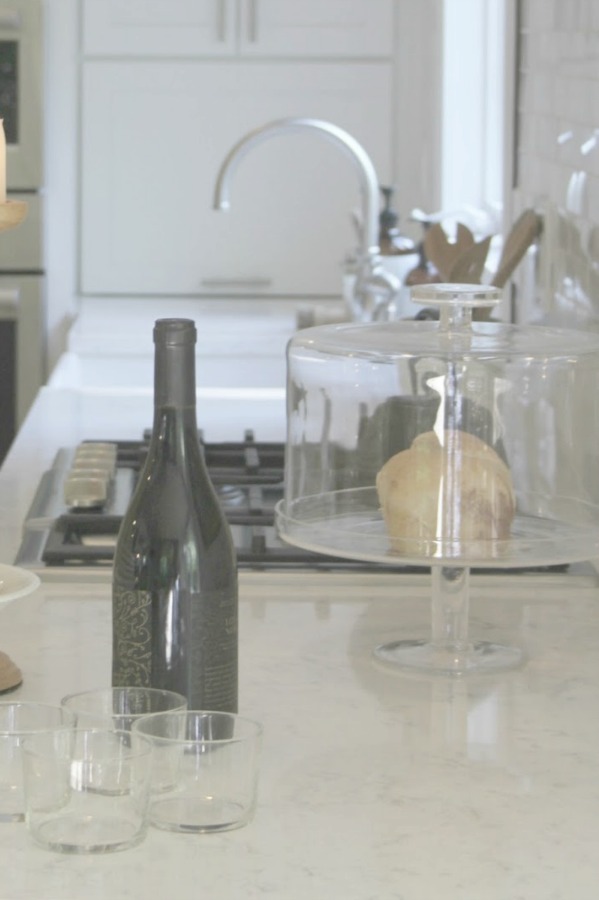 White kitchen with Viatera Minuet quartz countertops - Hello Lovely Studio.