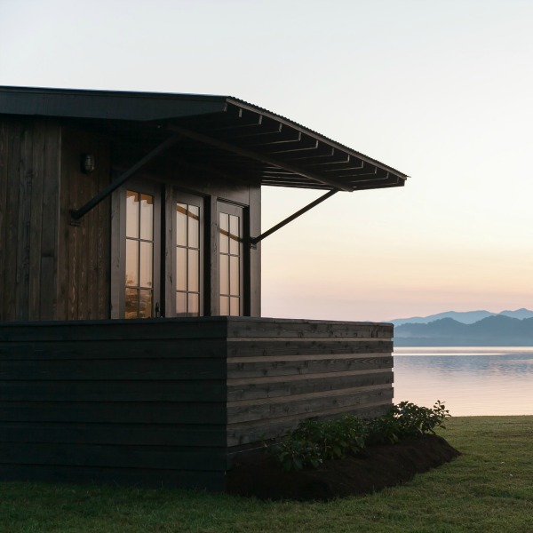 Tiny house beautiful! This saltbox style designer cottage by architect Jeffrey Dungan is offered at The Retreat by Oakstone.