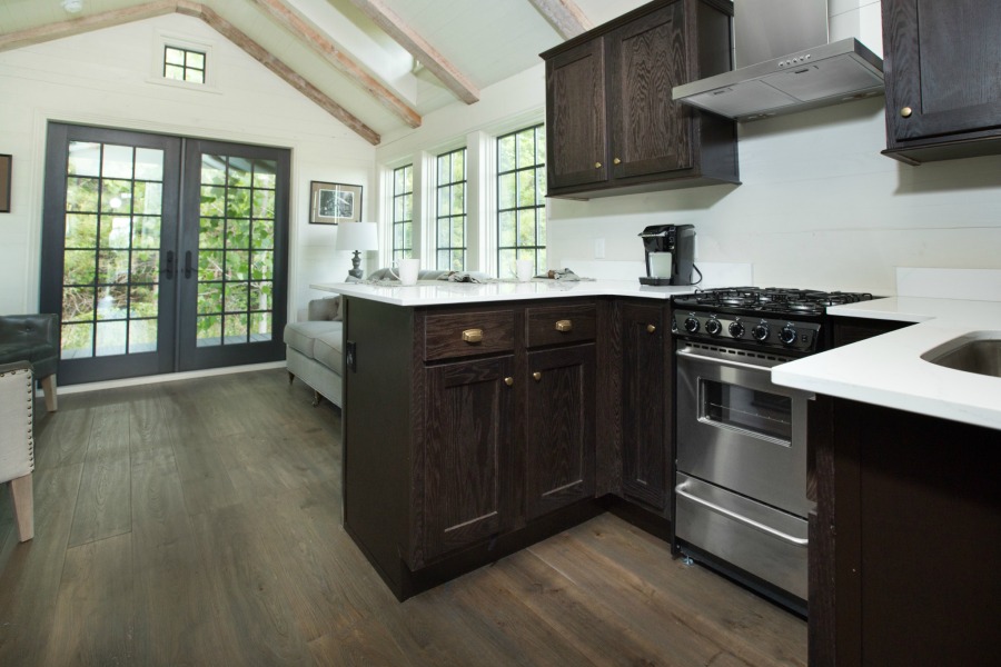 Tiny house kitchen design by Jeffrey Dungan, an exquisitely crafted luxurious Low Country style Designer Cottage at The Retreat at Oakstone.