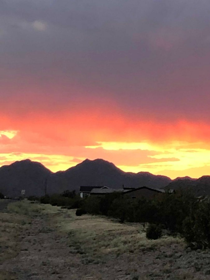 Pink and orange Arizona sunset over mountains - Hello Lovely Studio.