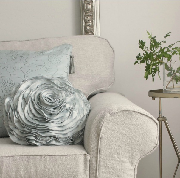 Belgian linen slipcovered sofa (Ikea Ektorp) in my Arizona living room with aqua accents - Hello Lovely Studio. Come be inspired by Get the Look: Warm White Living Room Design With Unfussy Sophisticated Style...certainly soothing indeed.