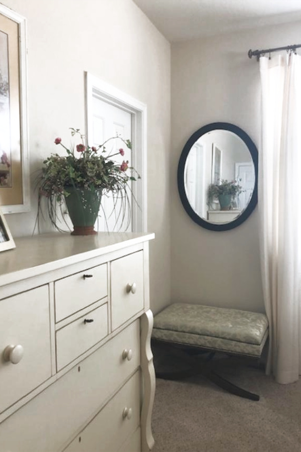 Benjamin Moore White Sand in a traditional style bedroom with Shaker dresser. #paintcolors #benjaminmoore #whitesand #whitepaintcolors #warmwhite #interiordesign