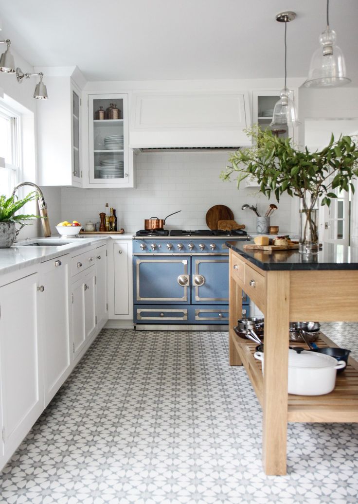 Gorgeous classic white kitchen with blue French range and cement tile in blue grey. Park & Oak.