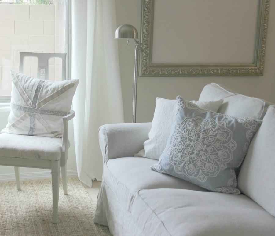 European farmhouse style in my living room with Belgian linen - Hello Lovely Studio. Come see 20 Beautiful White Sofas to Ignite Your Imagination!