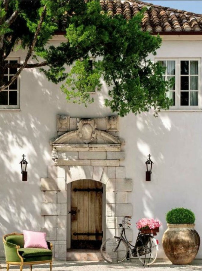 Gorgeous white stucco French farmhouse inspired house exterior with tile roof - Reagan Andre. #pamelapierce #reaganandre #frenchfarmhouse #houseexterior #housedesign #whitestucco