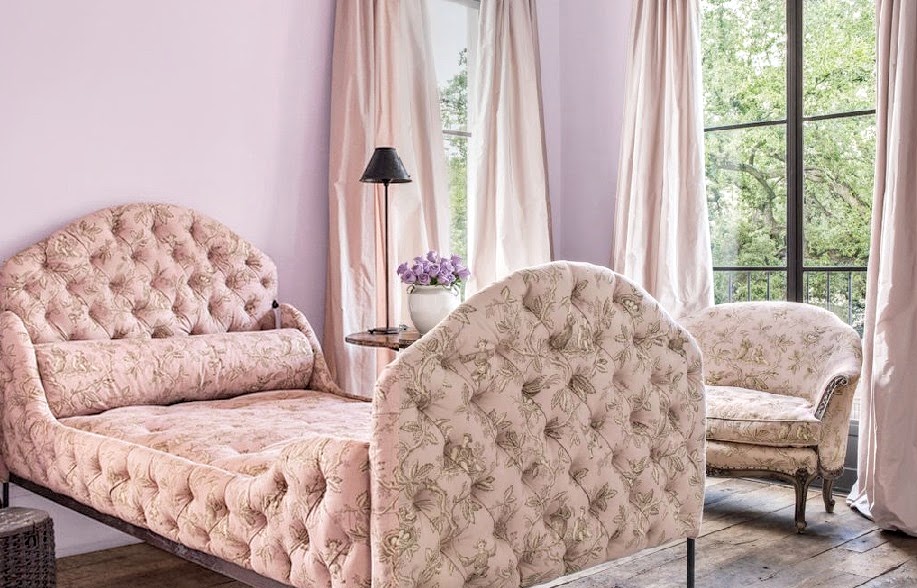 Pink print upholstery on an exquisite bed in a guest room by Pamela Pierce.