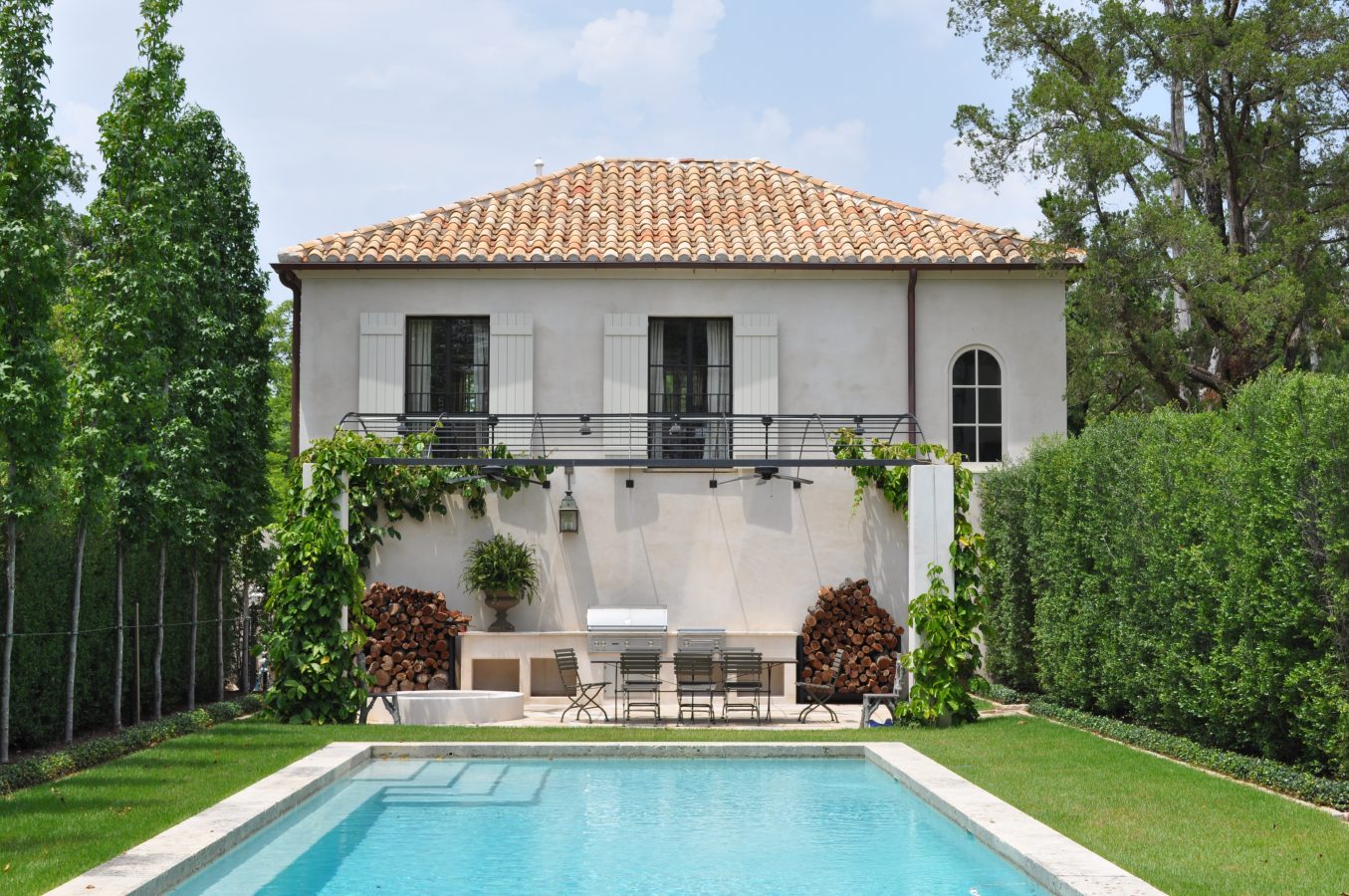 Rear facade of guest house at Montrose home in Houston. Come enjoy photos of this house tour with architecture by Reagan Andre.