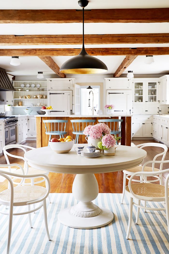 Gorgeously classic and traditional yet modern country breakfast nook with round dining table and light blue accents - in the home of OKL president Debbie Propst. #countrykitchens #moderncountrykitchen