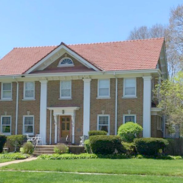 Charming vintage home exterior in Spring. Hello Lovely Studio.