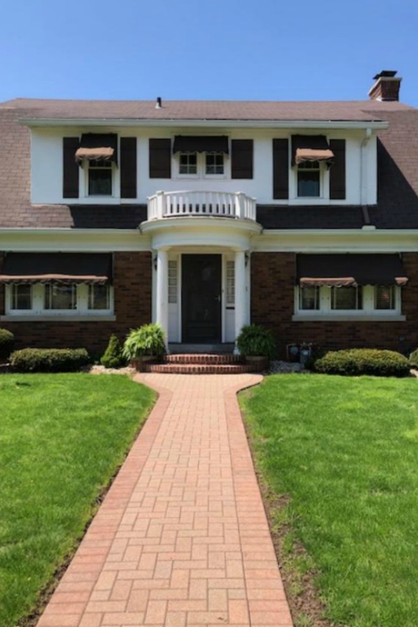 Charming vintage home exterior in Spring. Hello Lovely Studio.