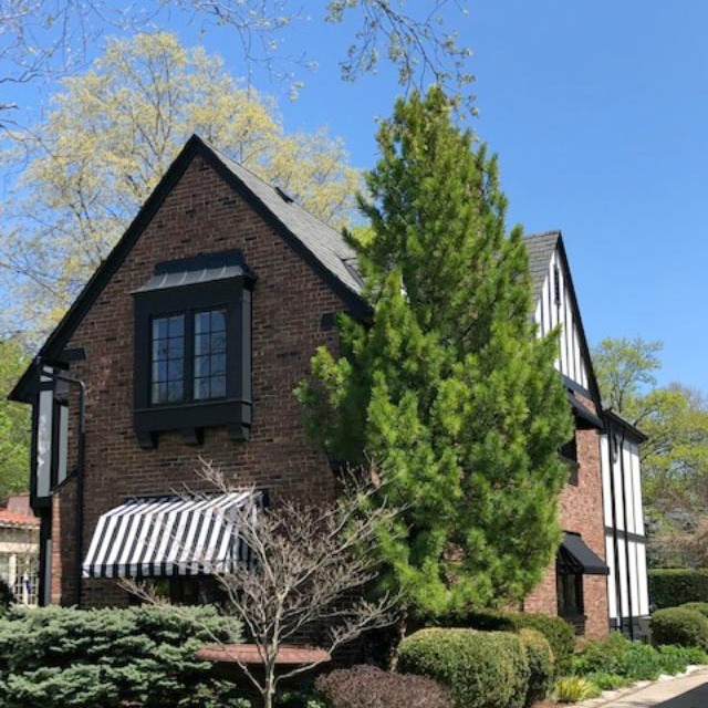 Charming vintage home exterior in Spring. Hello Lovely Studio.