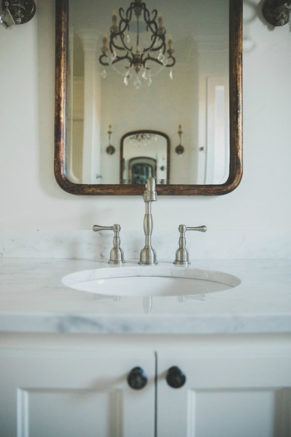 French country farmhouse white bathroom. Sherwin Williams Alabaster paint color on walls. Brit Jones Design.
