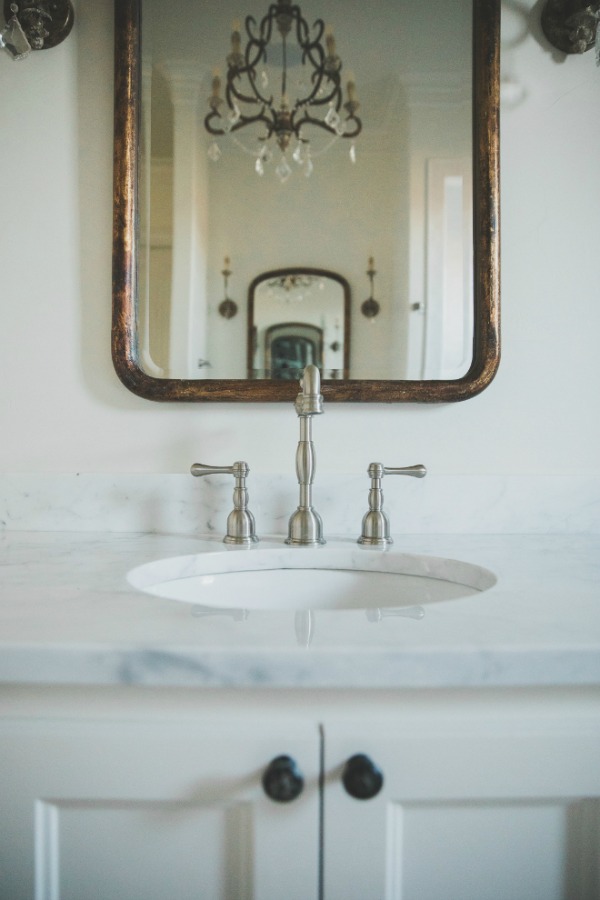 French country farmhouse white bathroom. Sherwin Williams Alabaster paint color on walls. Brit Jones Design.