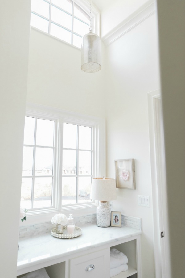 Alabaster color on walls of a beautiful white marble bath by Brit Jones.