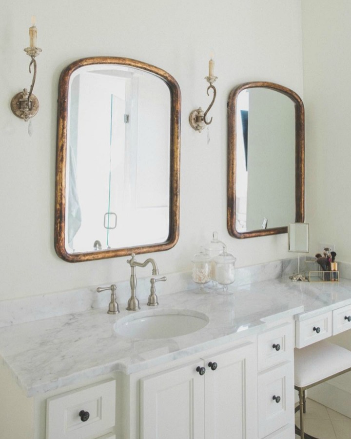 French country farmhouse bathroom with Sherwin Williams Alabaster paint color on walls. Brit Jones Design. Discover inspiring understated neutrals to try in your own home.