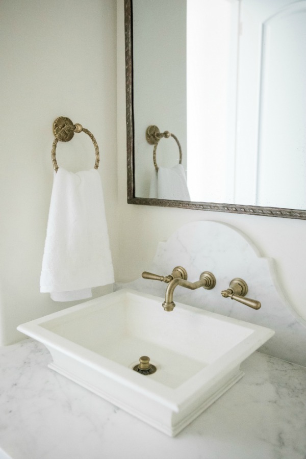 French country farmhouse white bathroom. Sherwin Williams Alabaster paint color on walls. Brit Jones Design.
