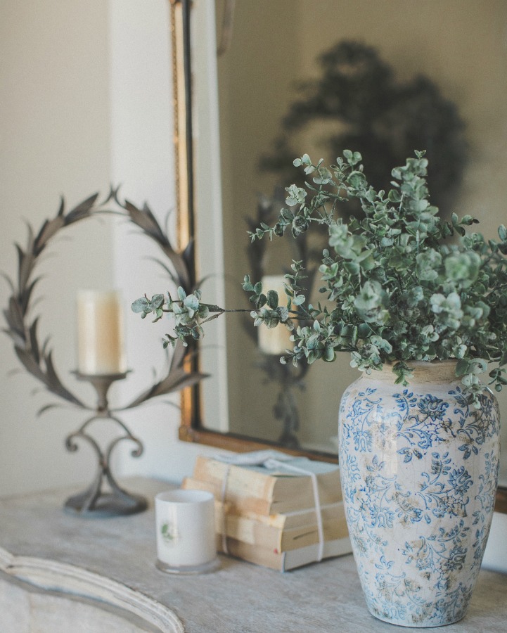 French country farmhouse decor on a console in an entry. Brit Jones Design.
