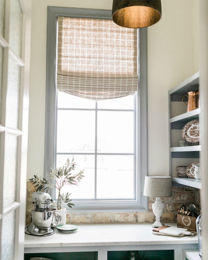 French country butler pantry, coffee room, or scullery with trim and shelves painted Sherwin Williams Uncertain Gray. Brit Jones Design.