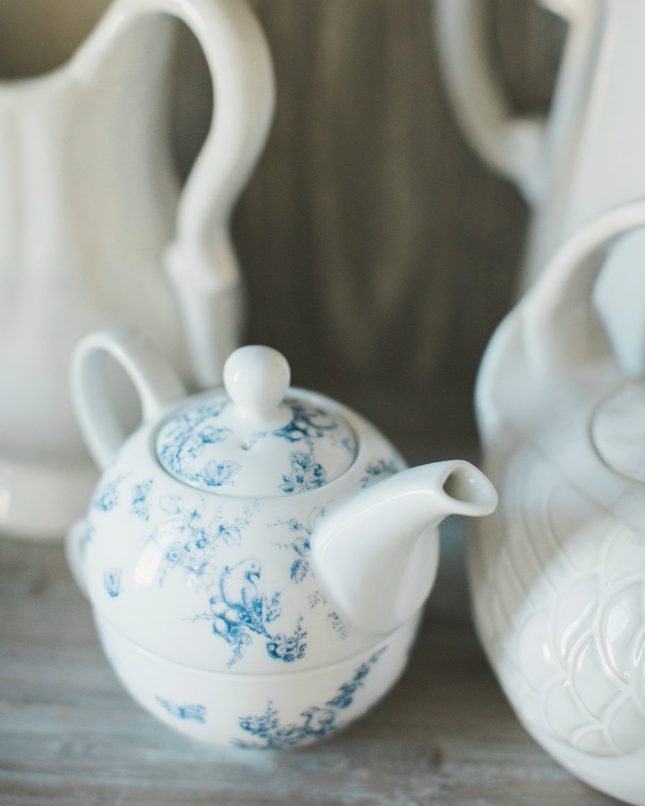 White and blue teapot and white ironstone vignette in a French country home. Brit Jones Design.