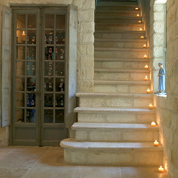 Stone staircase and reclaimed rustic wood doors - Chateau Domingue.