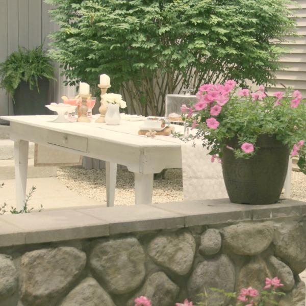 Romantic, simple, French courtyard with pink accents for a tea party - Hello Lovely Studio.