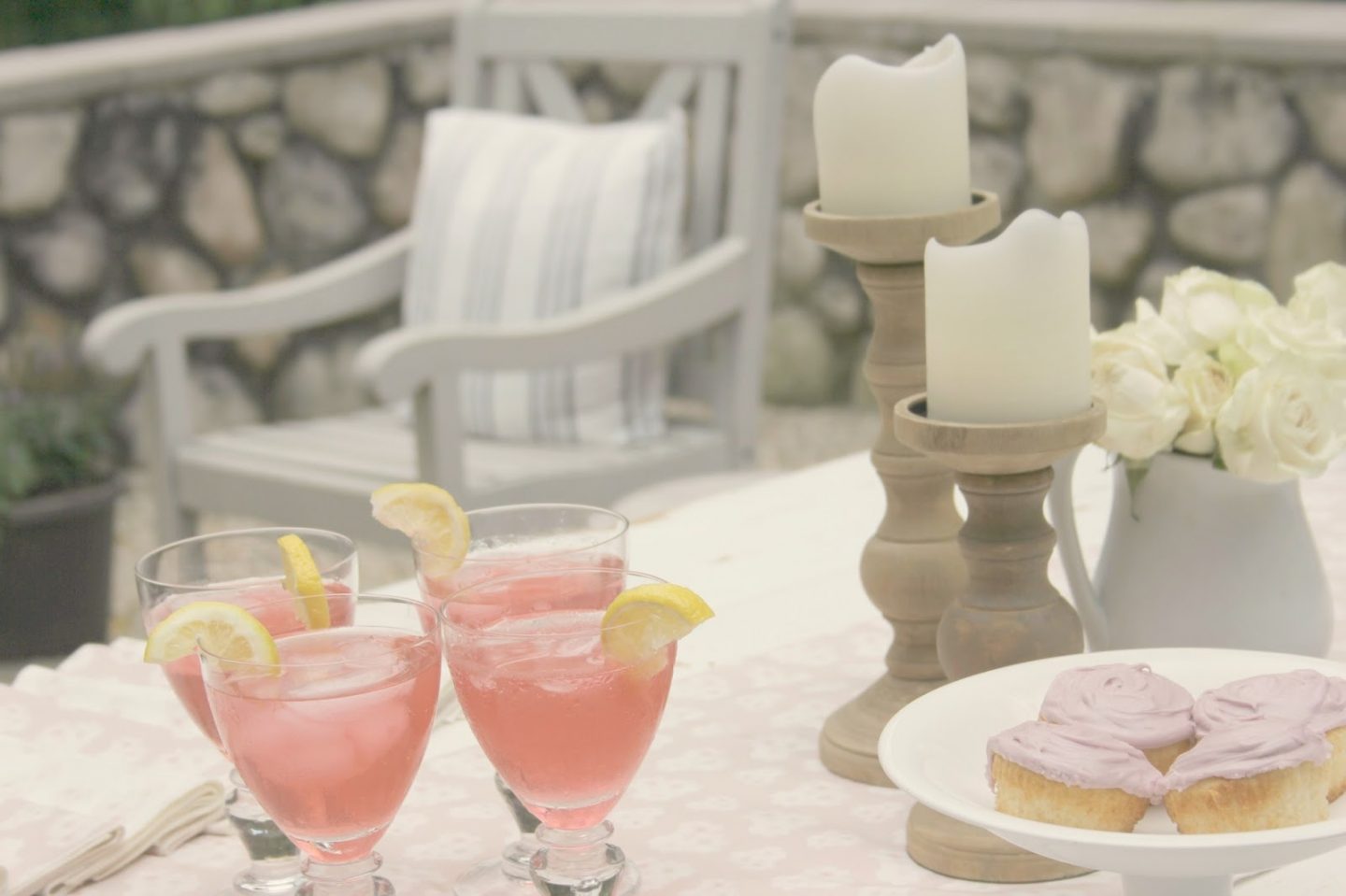 Romantic, simple, French courtyard with pink accents for a tea party - Hello Lovely Studio.