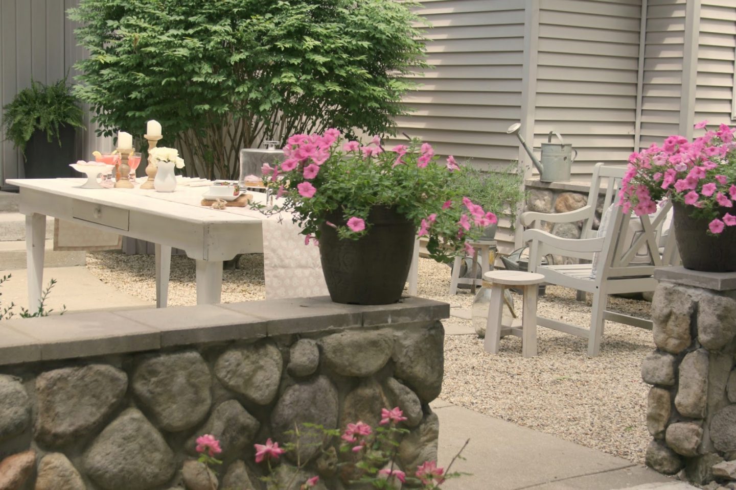 Romantic, simple, French courtyard with pink accents for a tea party - Hello Lovely Studio.