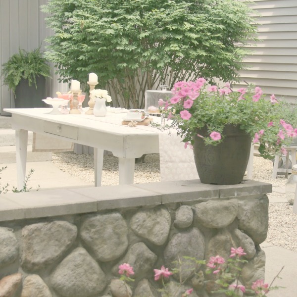 Romantic, simple, French courtyard with pink accents for a tea party - Hello Lovely Studio.