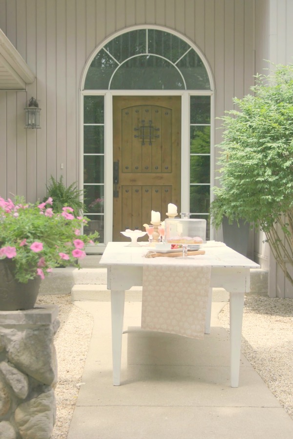 Romantic, simple, French courtyard with pink accents for a tea party - Hello Lovely Studio.