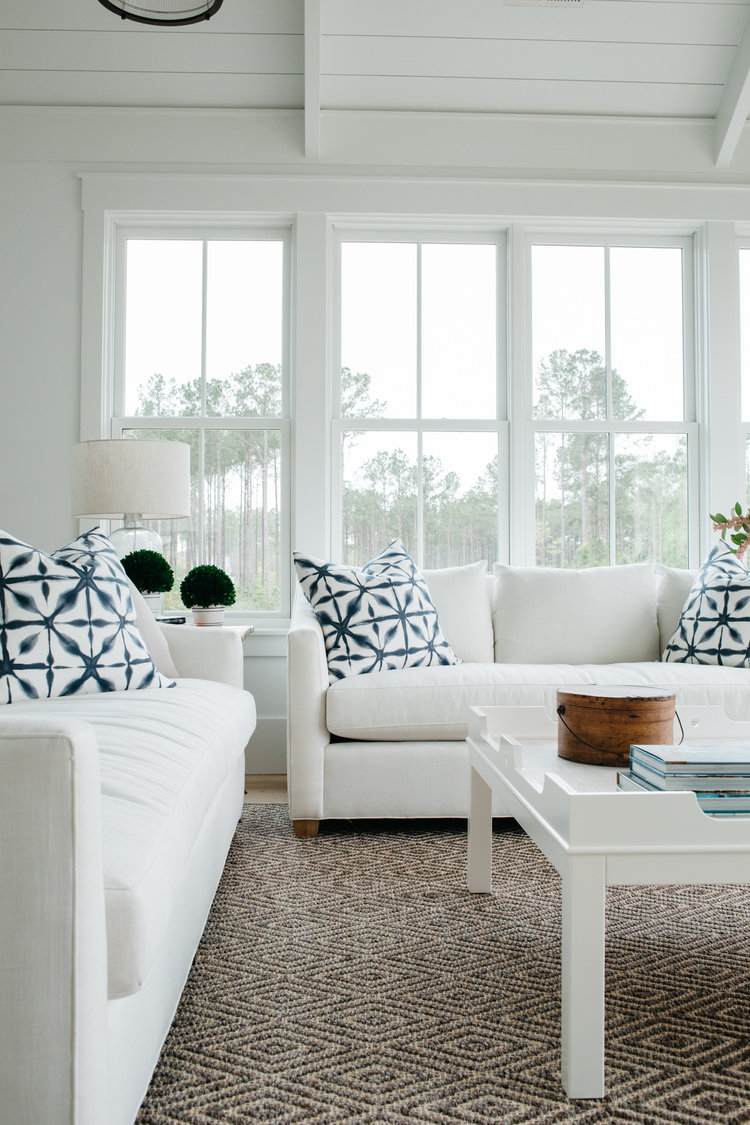 Benjamin Moore White OC-151 on shiplap, trim, walls, ceiling in blue and white living room with indigo accents. Board and batten coastal cottage iby Lisa Furey. #benjaminmoorewhite