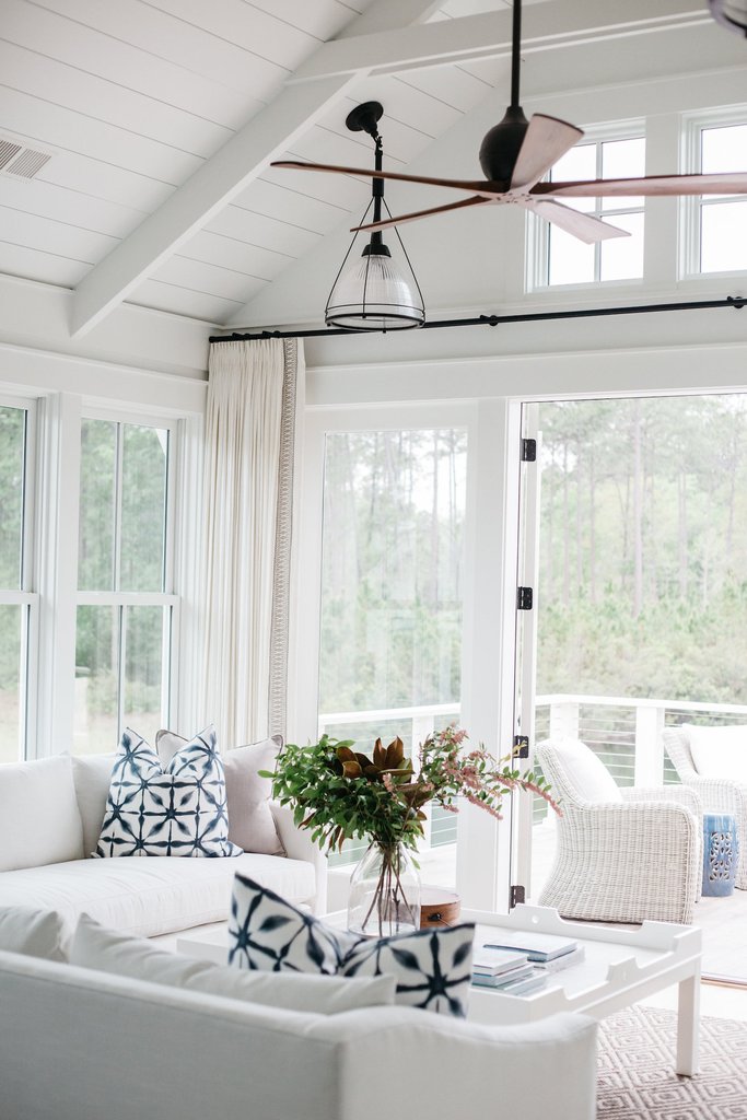 White living room in coastal cottage in Palmetto Bluff. Design by Lisa Furey. 