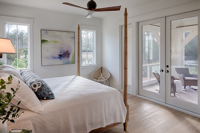 Coastal cottage bedroom with attached porch. Design by Lisa Furey.