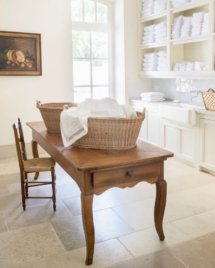 Laundry room in Le Mas de Poirers Provence French farmhouse. Come enjoy more Dreamy Laundry Room Inspiration to Re-imagine a Timeless Tranquil Design!