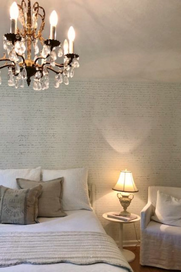 DIY Chic French Script Stenciled Accent Wall. Country French farmhouse style bedroom with French script stenciled wall by Hello Lovely Studio. #frenchcountry #frenchfarmhouse #frenchscript #diy #stenciledwall